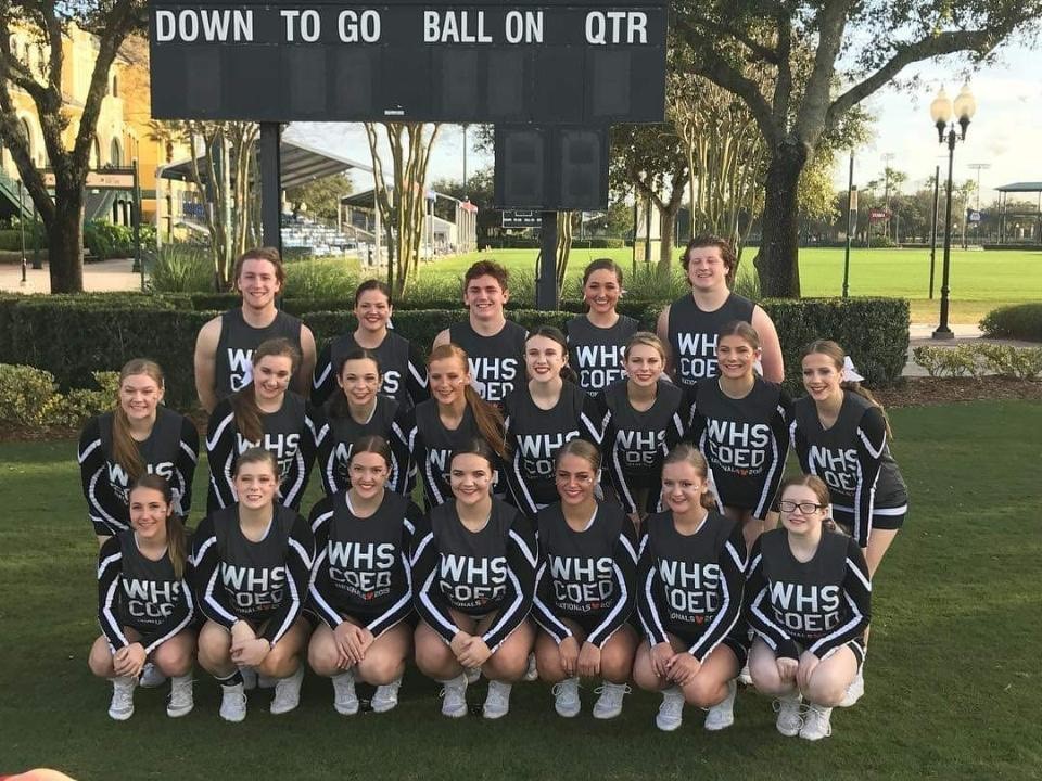 group of cheerleaders wearing matching shirts